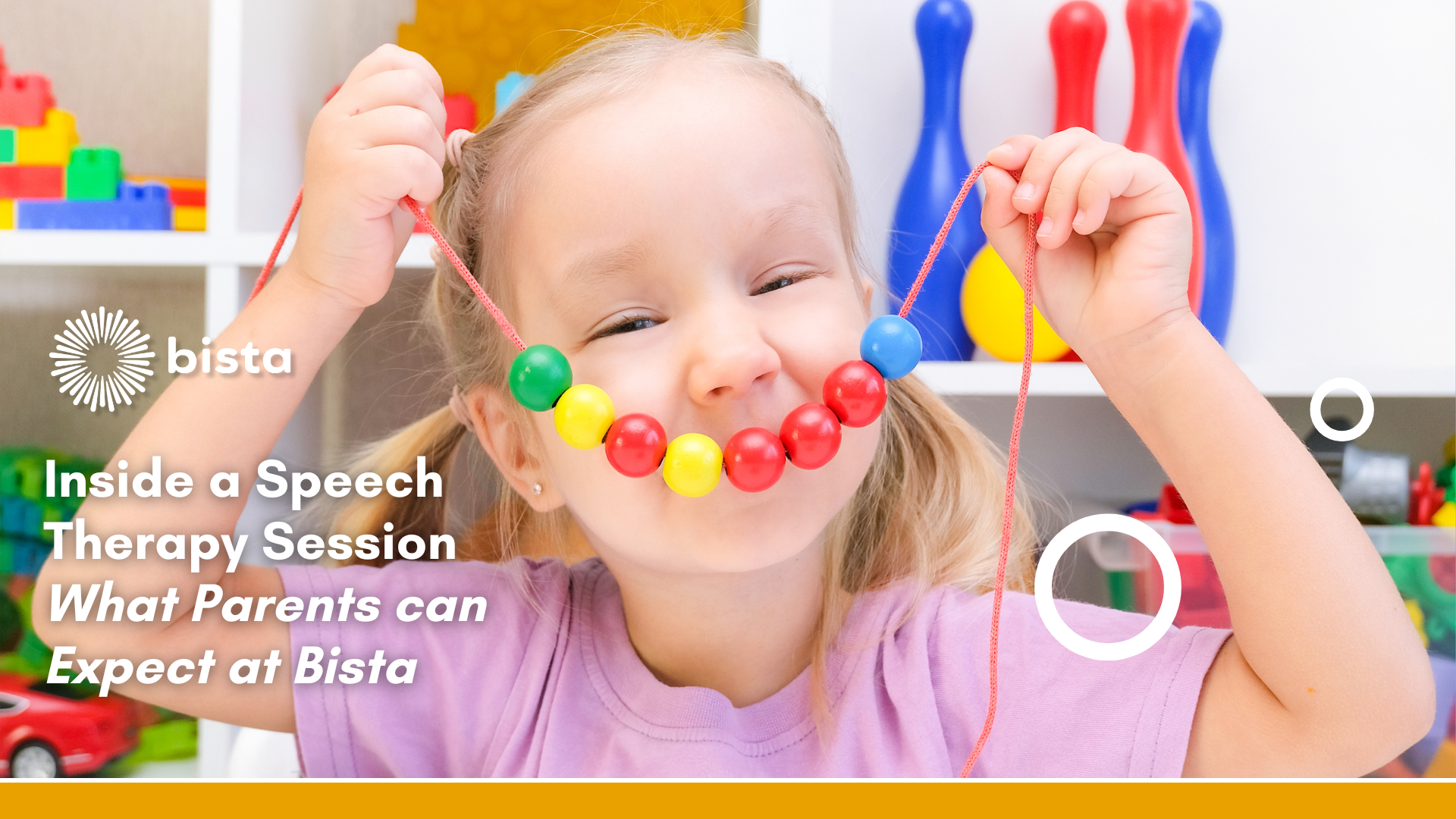 Child with autism in speech therapy session smiling