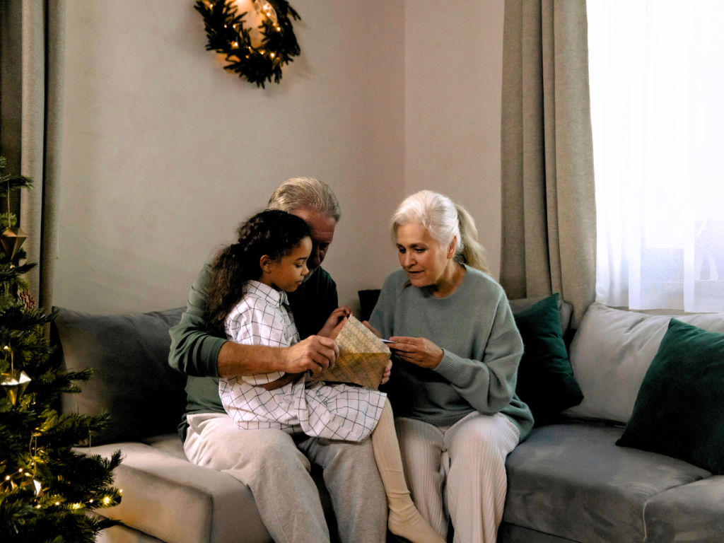 Grandparents connecting with a child who has autism in living room