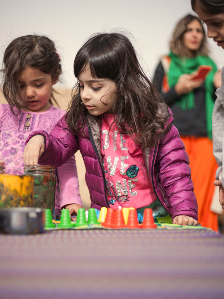 Child playing with toys in ABA therapy session