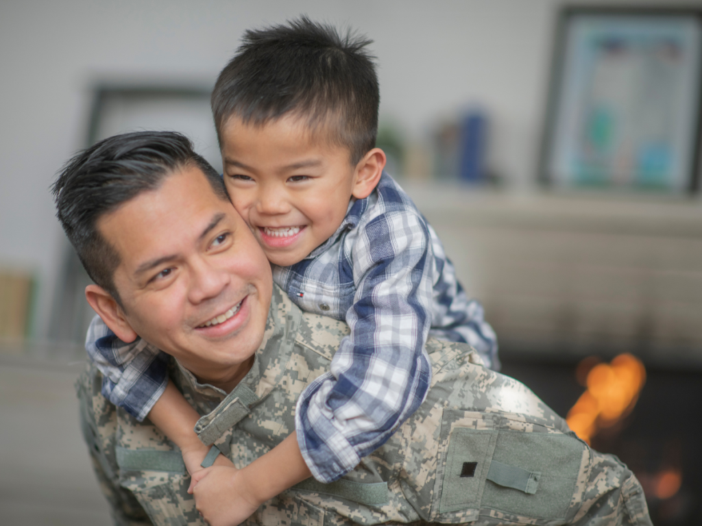Dad carrying child on back both laughing and having fun. Dad is thinking about ABA cost